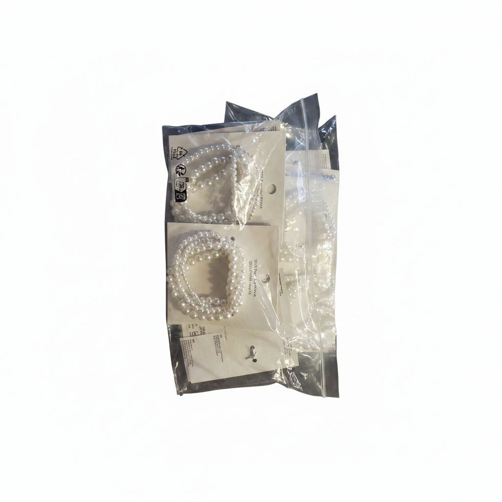 H&M 4 Pack Beaded Bracelets – Packaged bracelets on white background
