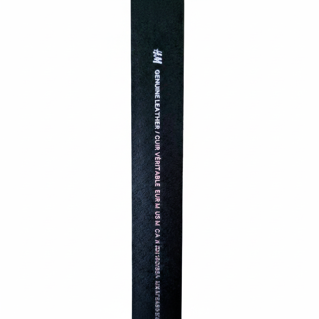 H&M Men's Genuine Leather Belt Medium – Belt edge showing H&M Genuine Leather embossed text on white background
